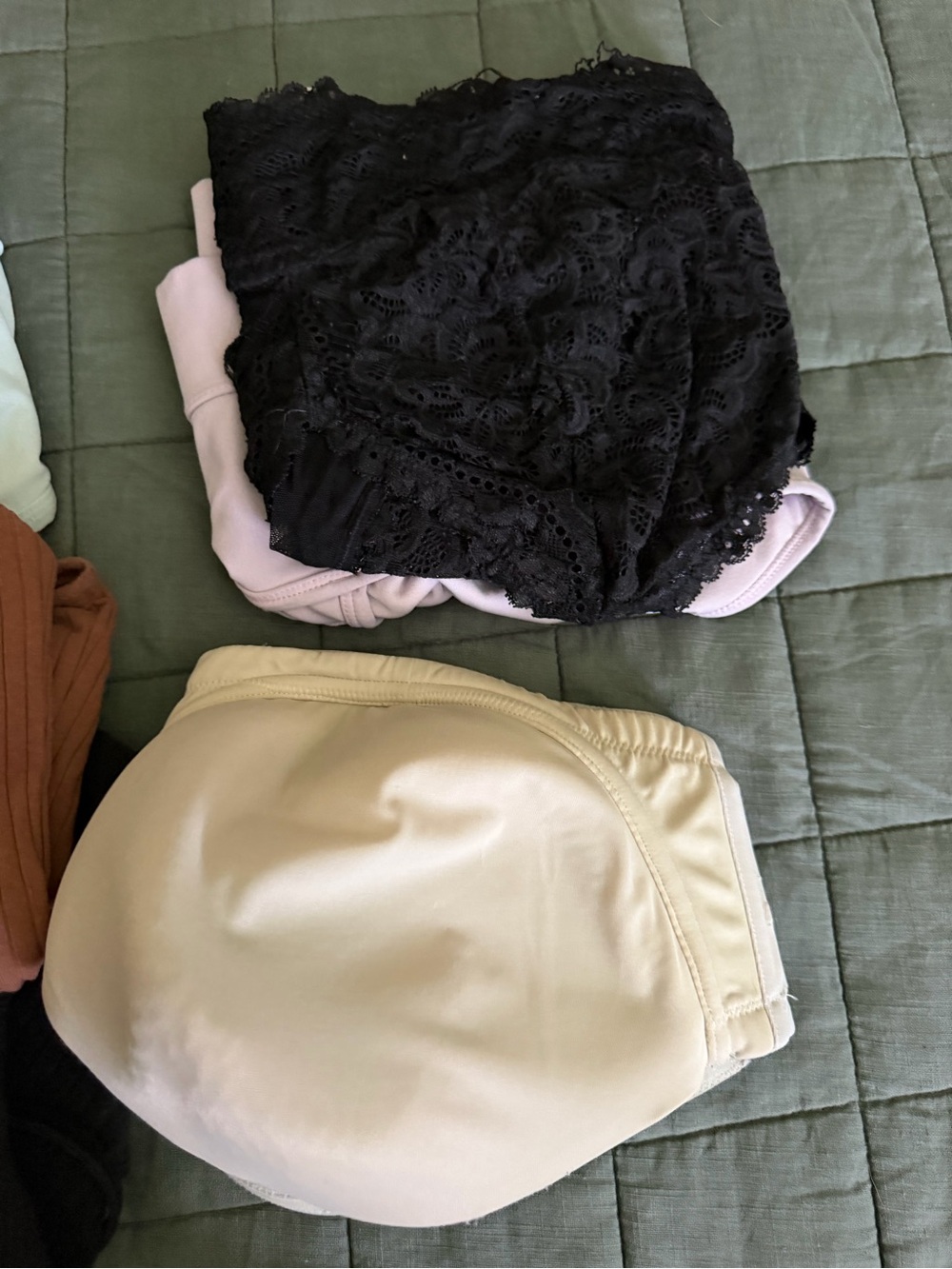 Assorted bras, sports bras, and crop cami bra.
